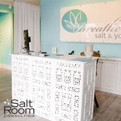 Breathe salt and yoga lobby area in white and light blue colors