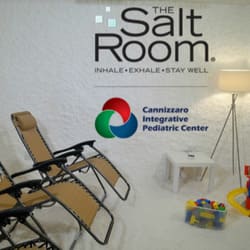 The salt room longwood florida with two lounge chairs and a lamp